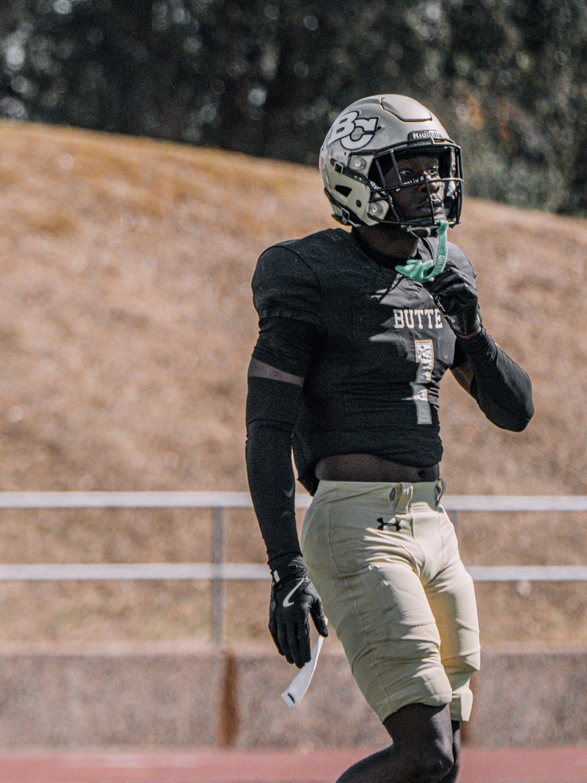 Butte College football player with the ball